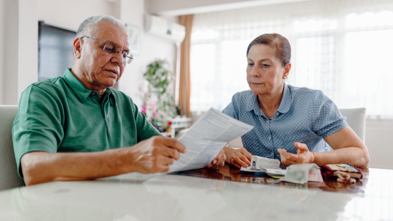 A couple looks over paperwork.