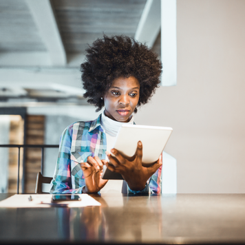 Woman doing work on her tablet