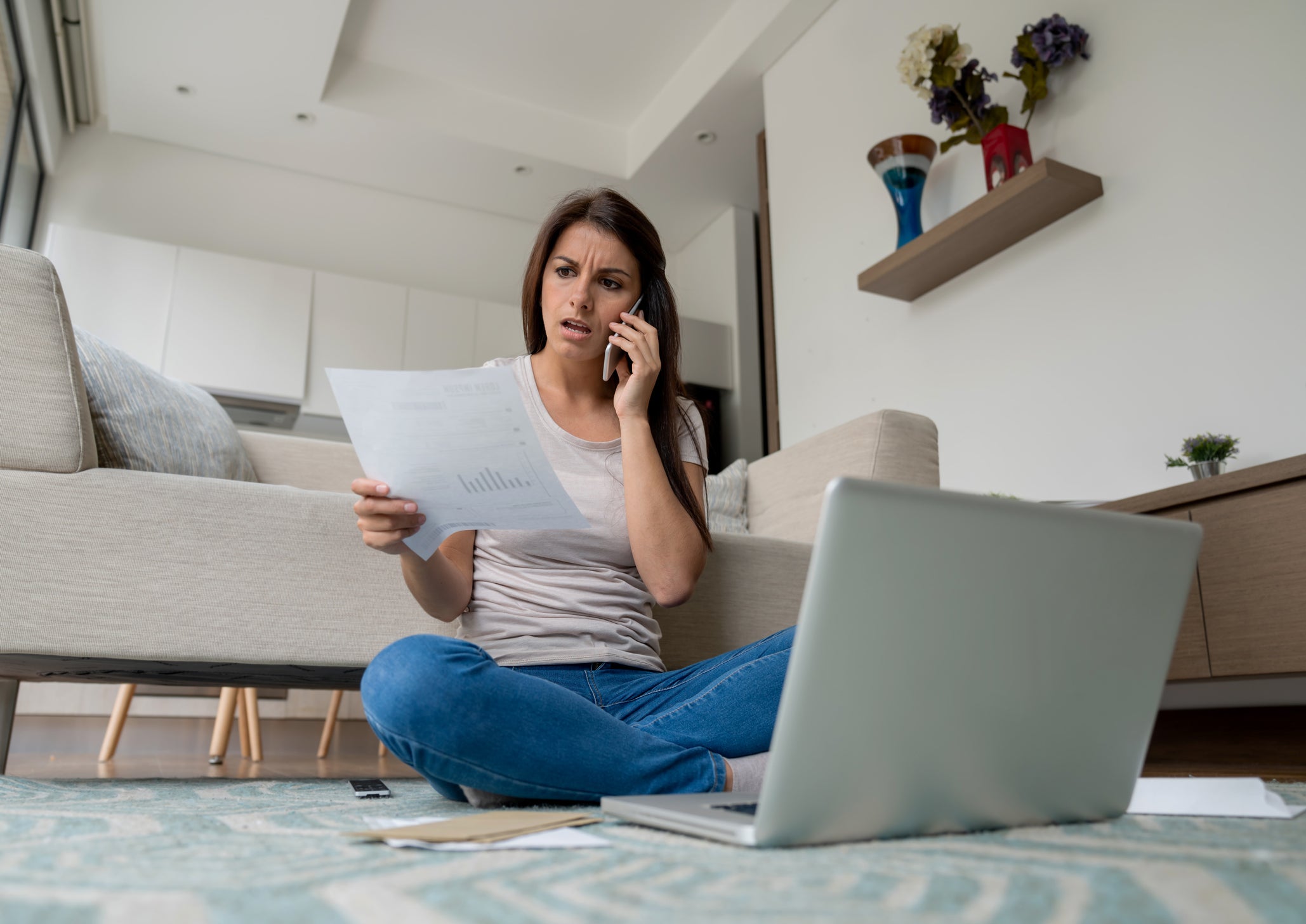 Woman at home complaining about on the phone