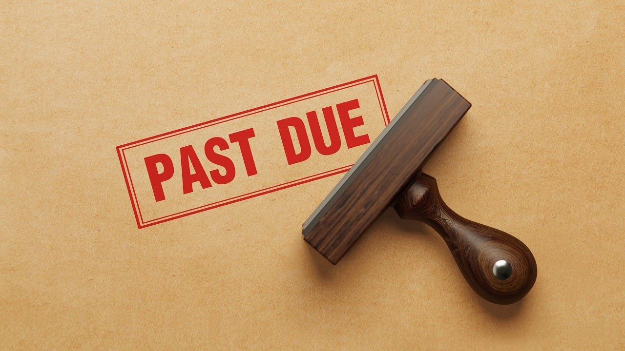 Wooden Past Due Stamp On Recycled Paper