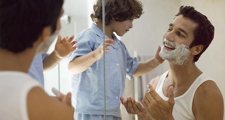 Toddler helping his father shave © Air Images/Shutterstock.com