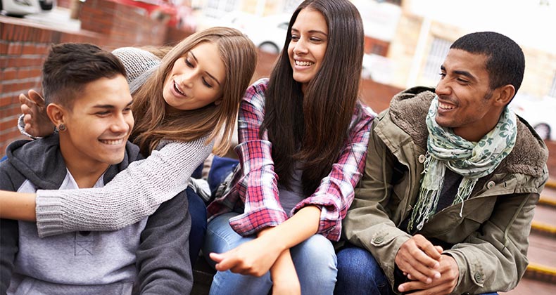Millennial friends hanging out | PeopleImages/Getty Images