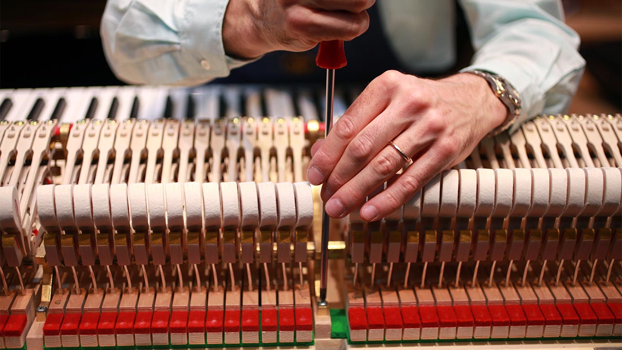 A piano tuner at work
