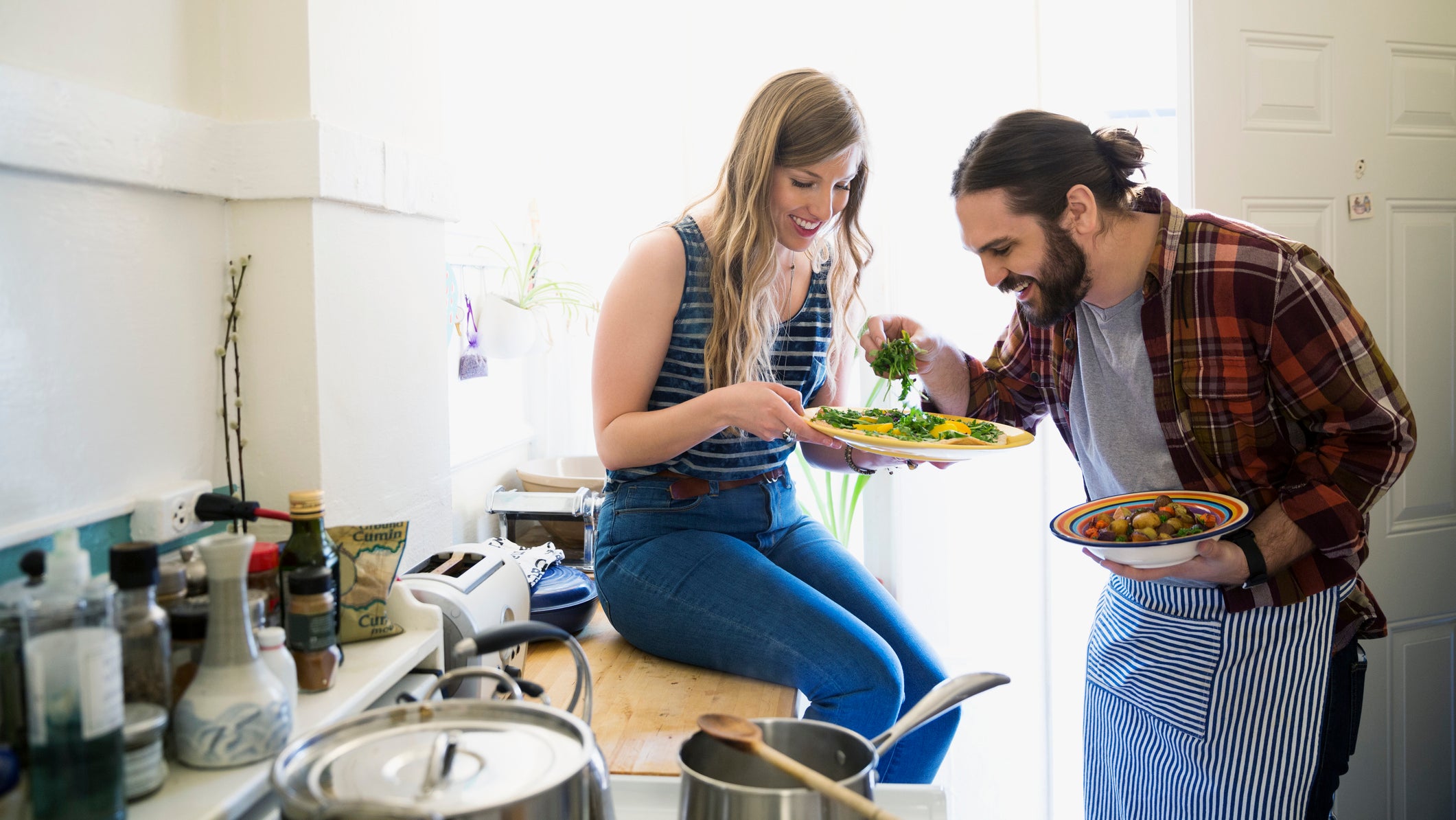 Couple cooking in kitchen