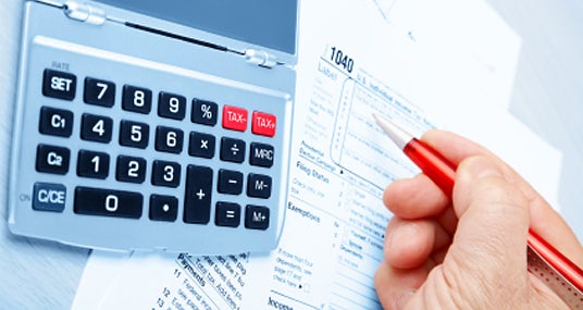 Working on taxes © iStockPhoto.com