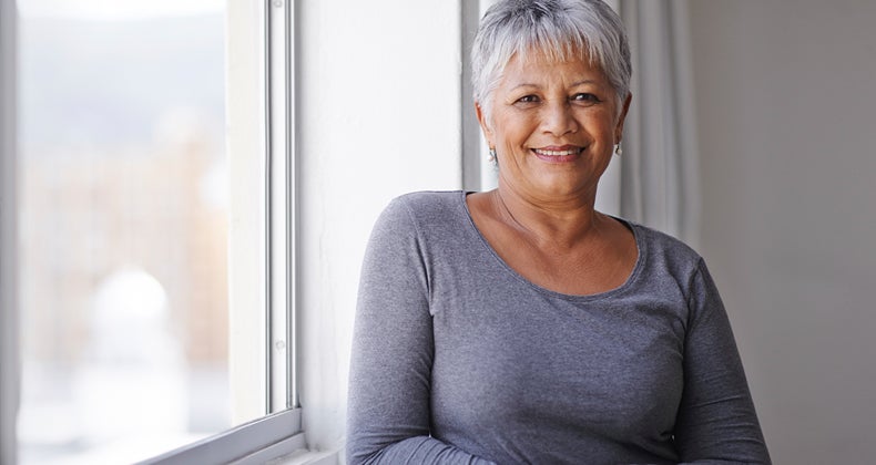 Woman posing by window © iStock