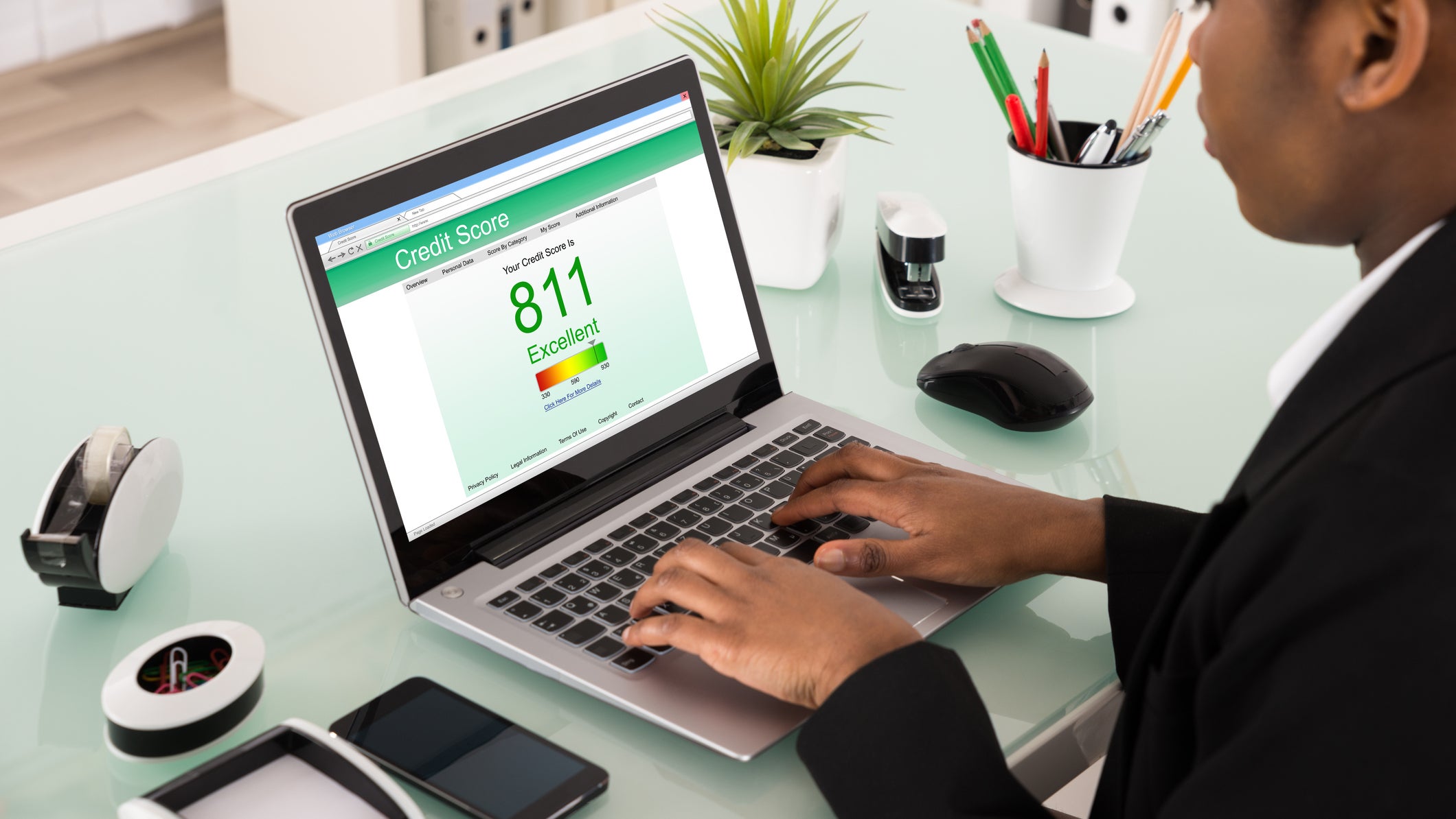 Businesswoman Checking Credit Score On Laptop