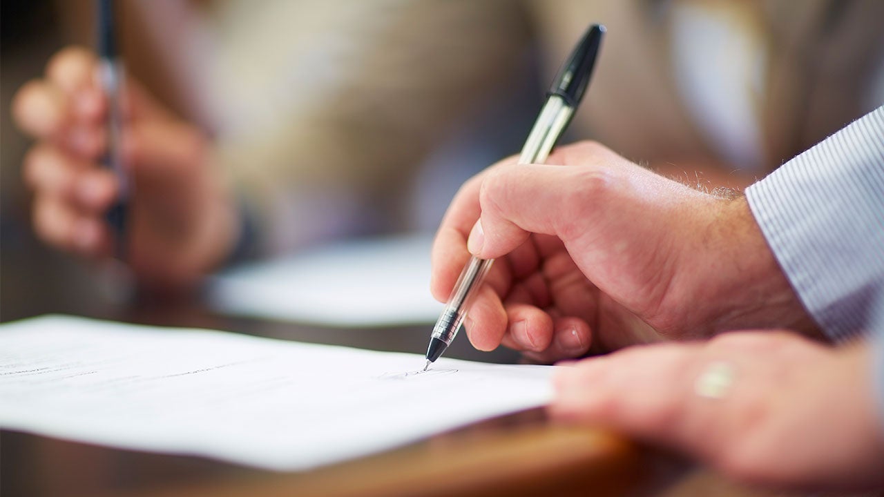 Man signing contract