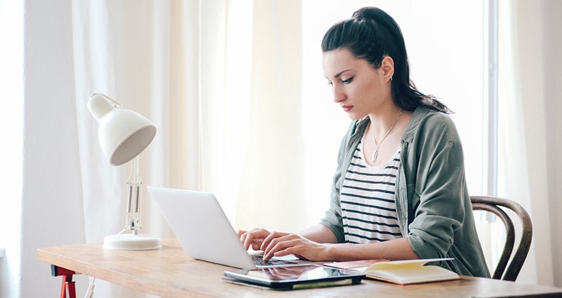 Woman working in her home office © iStock