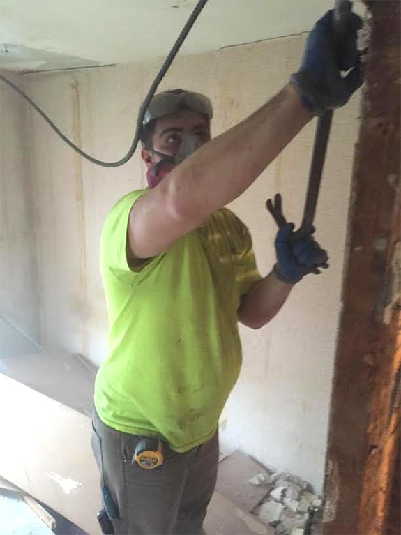 Michael Zonin completes demo work on a house | Photo courtesy of Marc Aschoff
