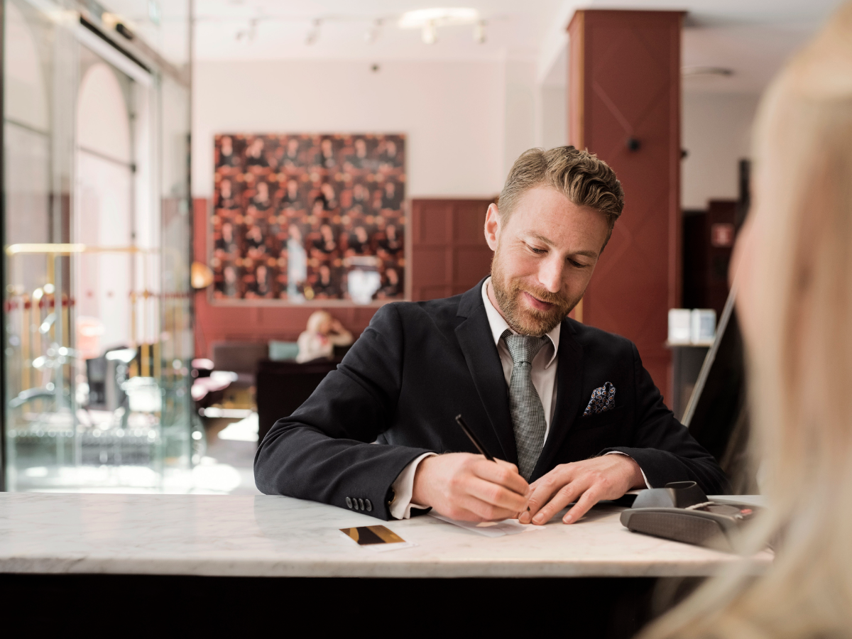 Man standing at bank counter