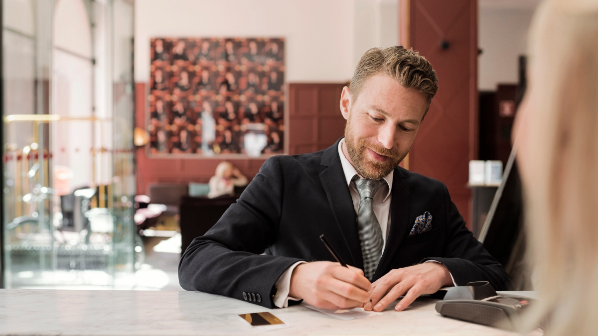 Man standing at bank counter