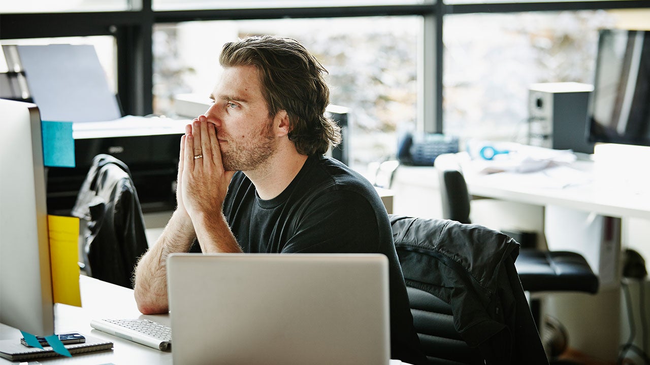 Person folds his hands in front of their face