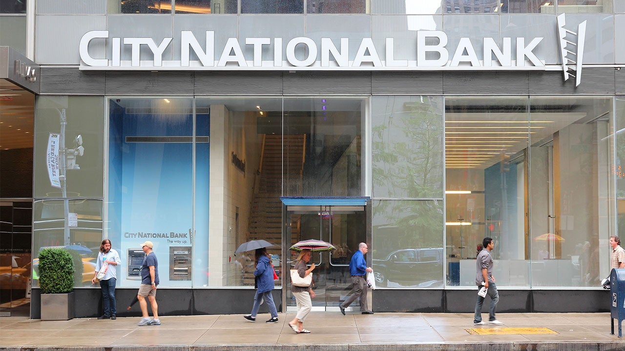 People walking by City National Bank