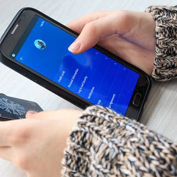 Woman using phone for mobile banking