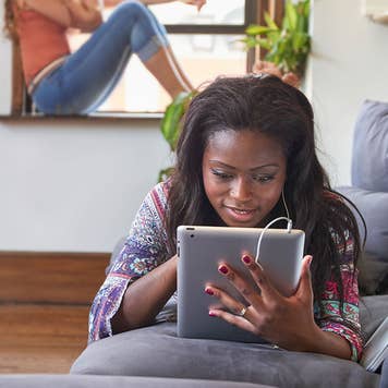 Woman on tablet looking at student loans