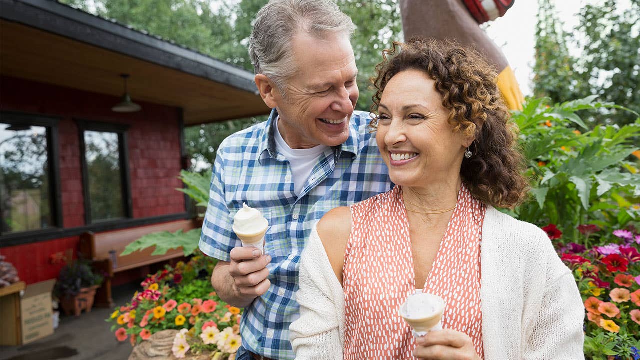 Middle aged couple eating ice cream