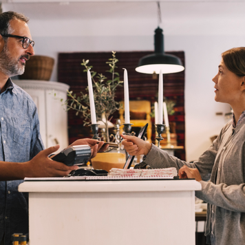 women paying at register