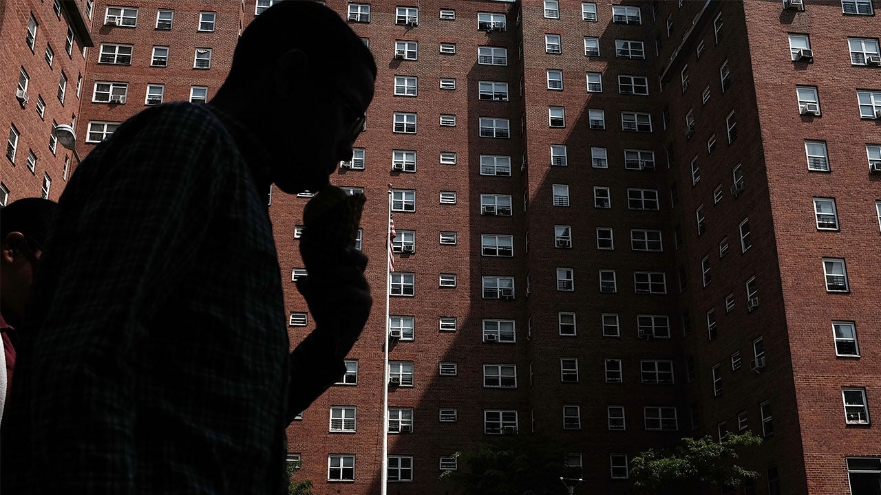 Man walking by public housing