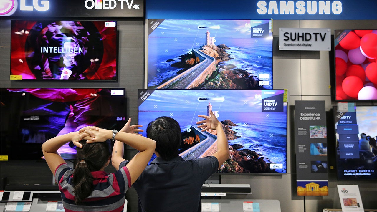 Couple choosing new television set