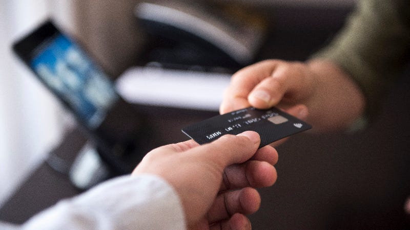 Person holding credit card