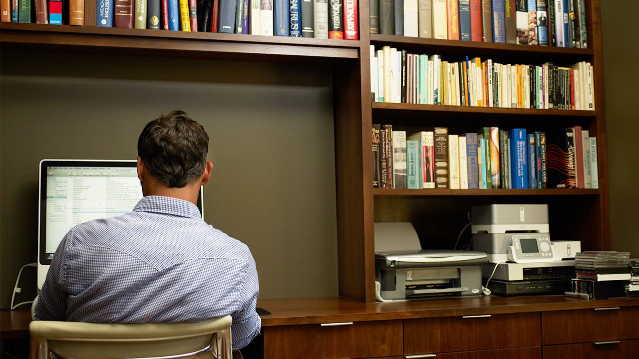 Man using computer in home office