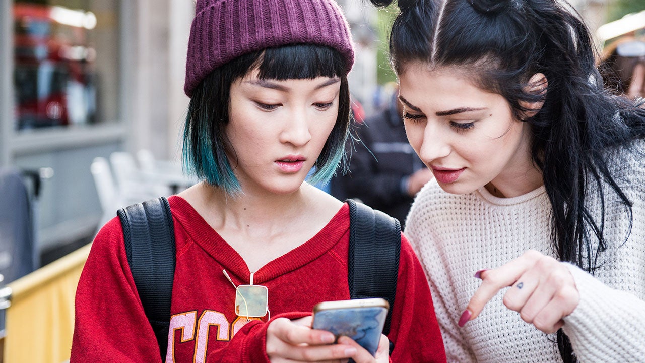 Friends looking at phone