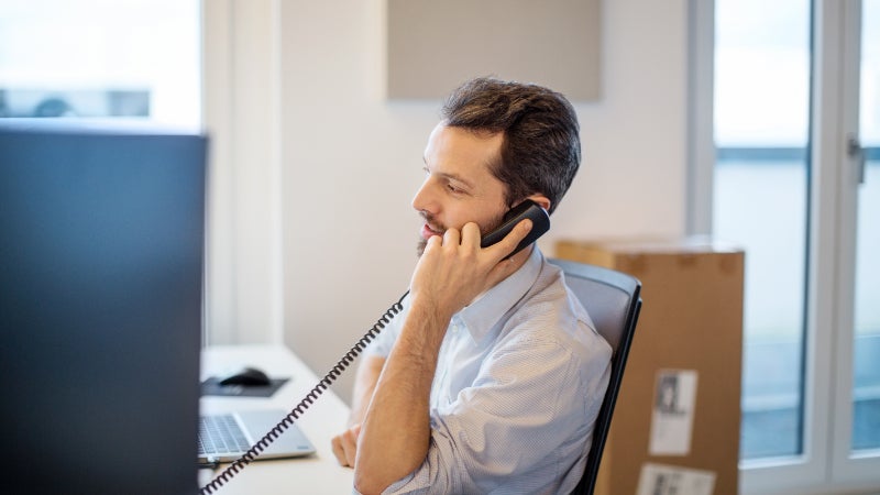businessman talking on phone in office 