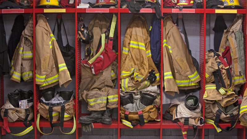 Firefighter uniforms hanging in locker