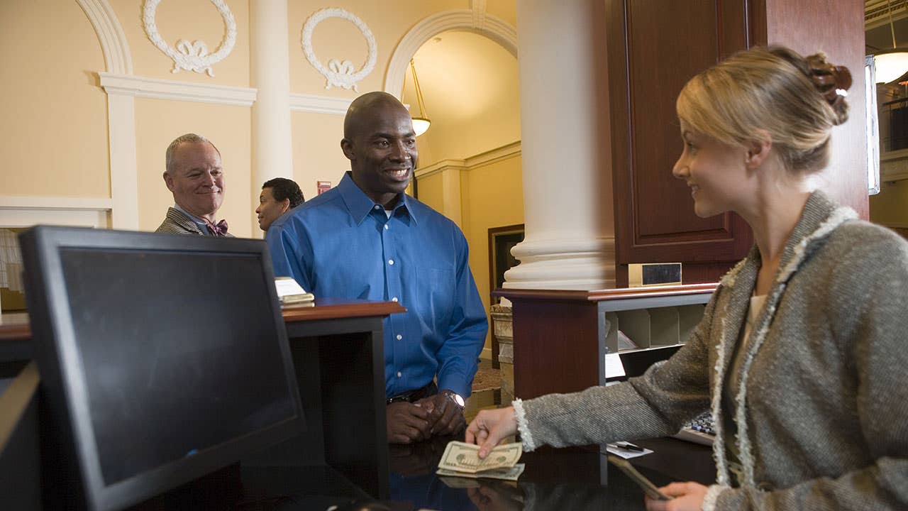 Bank teller with customer