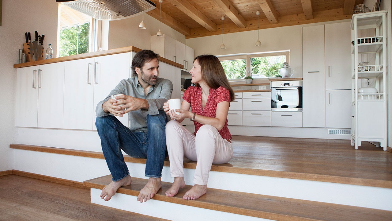 Couple sitting in kitchen