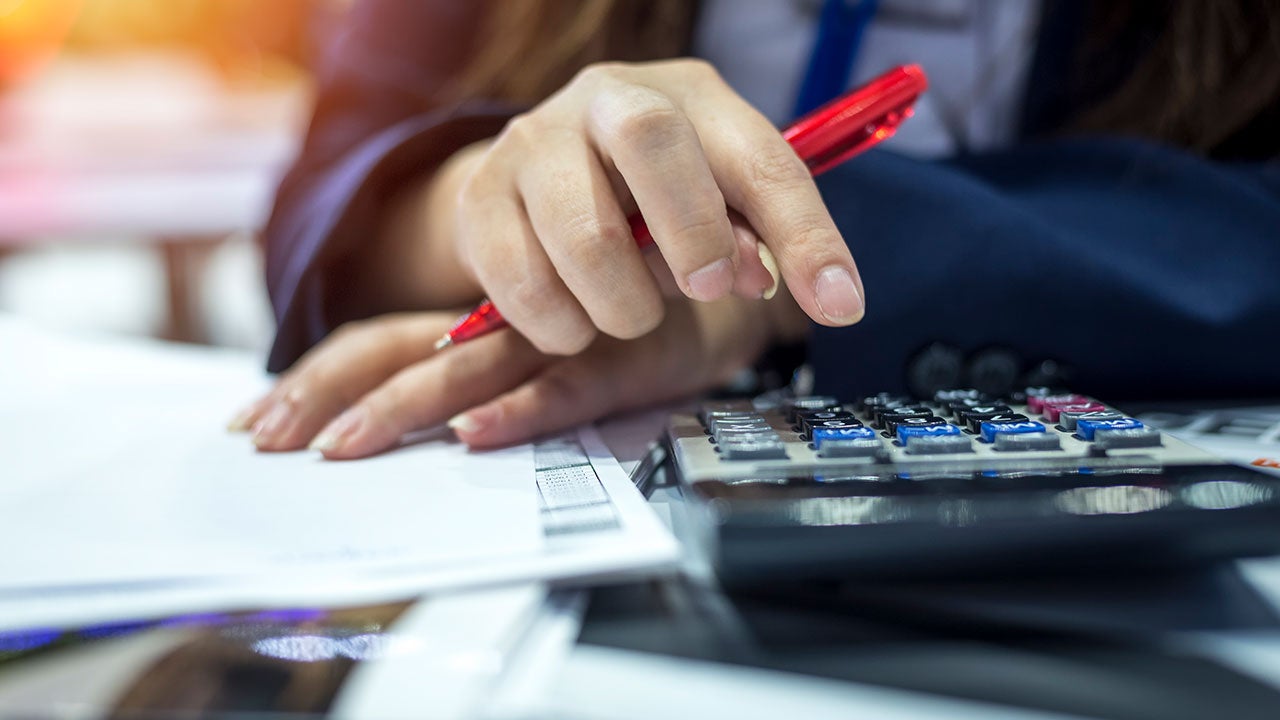 Woman using a calculator