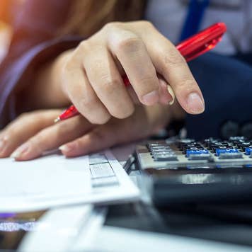 Woman using a calculator