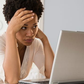distressed woman with laptop