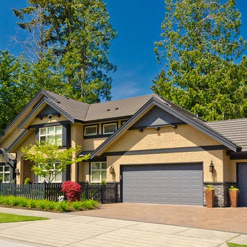 Yellow house with trees
