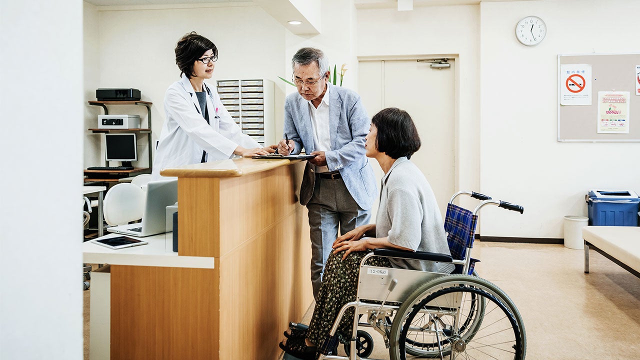 Man checking out his wife from the hospital