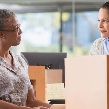 Woman at bank talking to teller