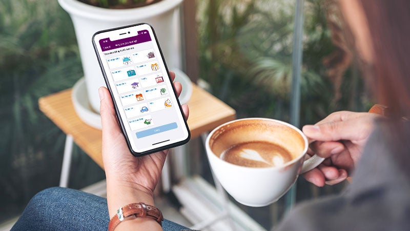 A woman looking at Ally Bank's new savings tools.