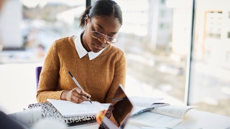Girl studying at computer