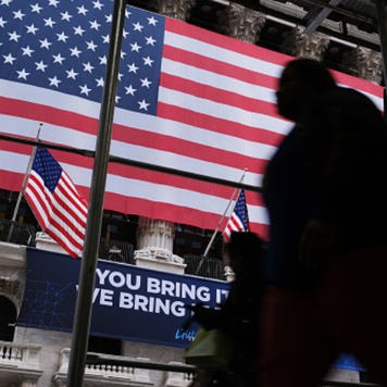 People walk outside the New York Stock Exchange