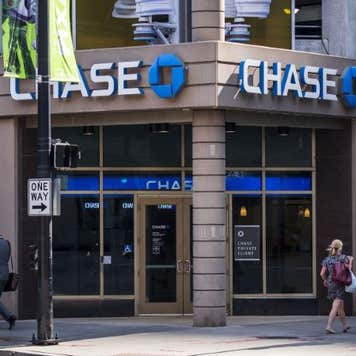 Customers walk past a Chase Bank branch.