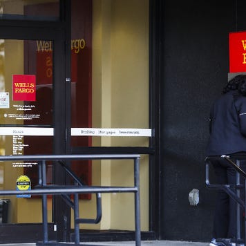 A woman uses a Wells Fargo ATM.
