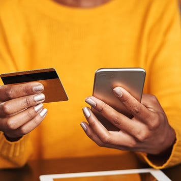 Person holding credit card