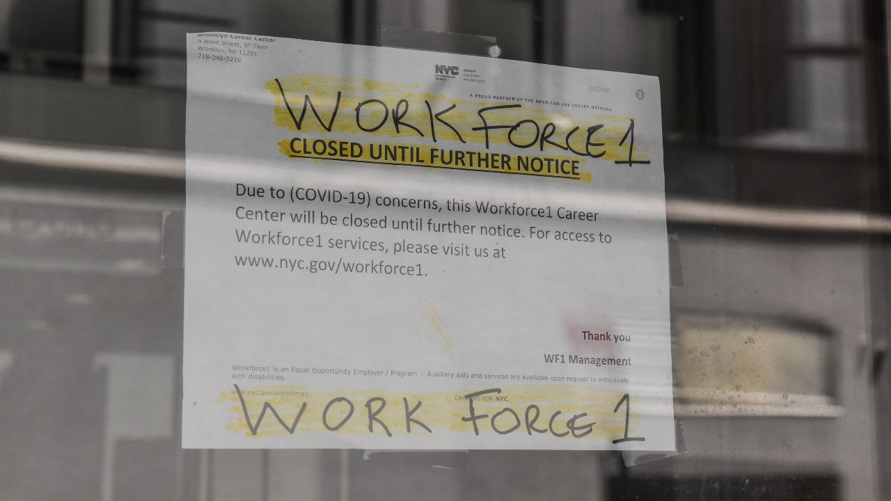 A sign stating that job placement program is closed during coronavirus pandemic.