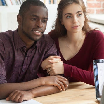 Borrowers meet with a mortgage lender.