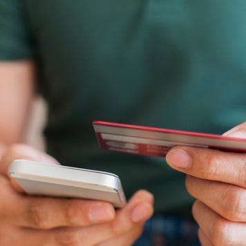 Person holding credit card