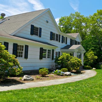 An exterior of a home and yard