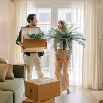 Asian couple moving new house