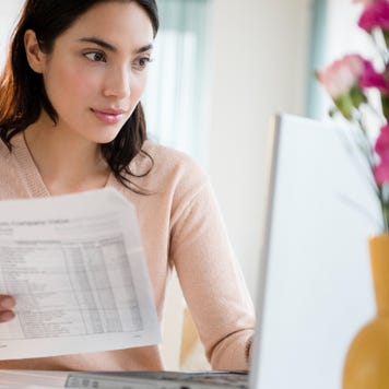 Person paying bills on laptop