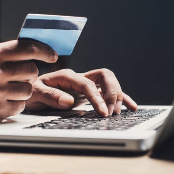 Person holding credit card